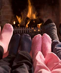 stocking feet by fireplace