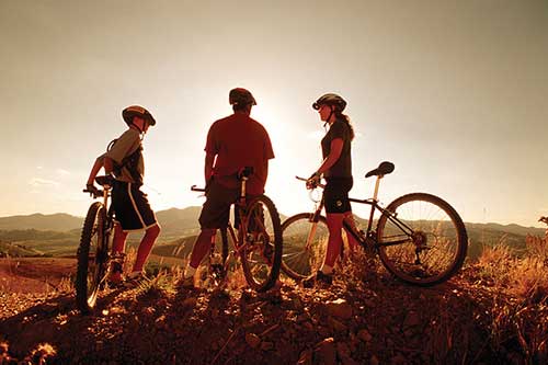 three mountain bikers