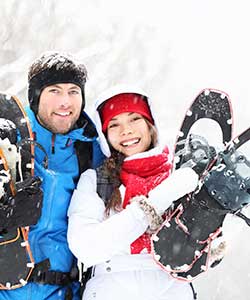 couple with snowshoes