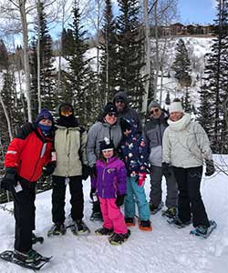 family snowshoeing